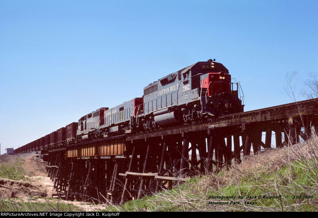 SSW, Cotton Belt 7962-SP 1611-SSW 7963, is eastbound crossing over Greens Bayou at Houmont Park, Texas. March 8, 1984.